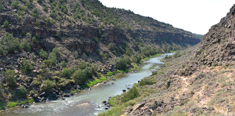 Black Rock hot spring isn't quite visible from the road, but it is a relatively short hike down to the edge of the Rio Grande. The water in the spring is clear and cool enough (though still warm) to be enjoyed during the day.