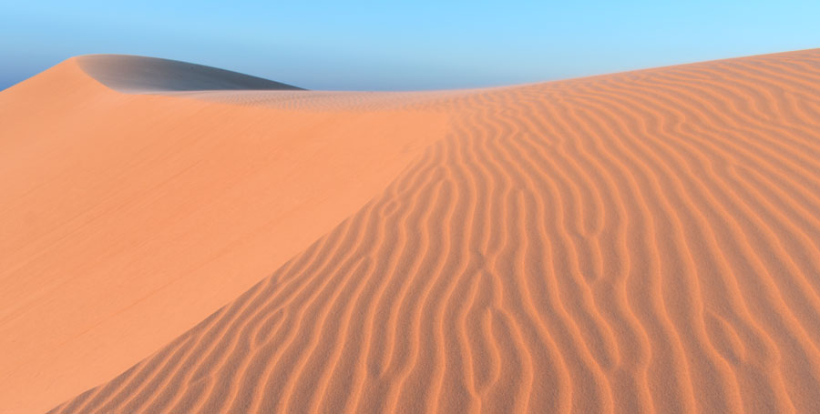 The sun setting over Monahans Sandhills State Park, Texas.