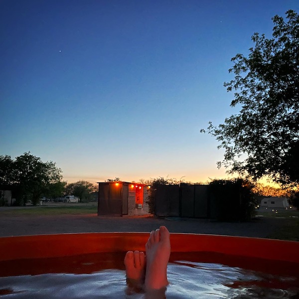 Toes sticking out of hot tub.