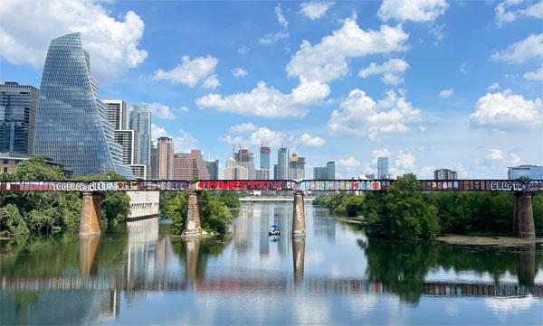 Downtown Austin behind a bridge over the Colorado River.