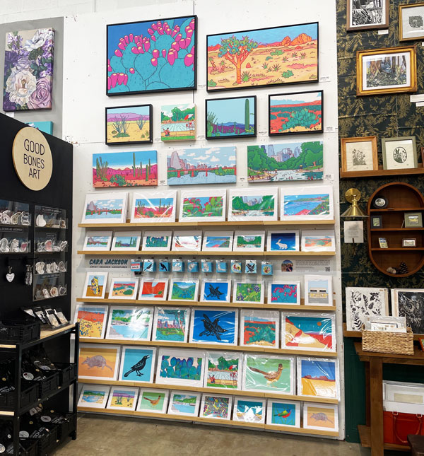 Wall of art prints and paintings at the Blue Genie Art Bazaar.